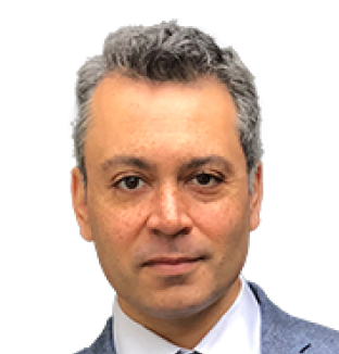 Headshot of Alex Robinson, Managing Director Academic and Chief Commercial Officer, wearing a white shirt with a grey blazer